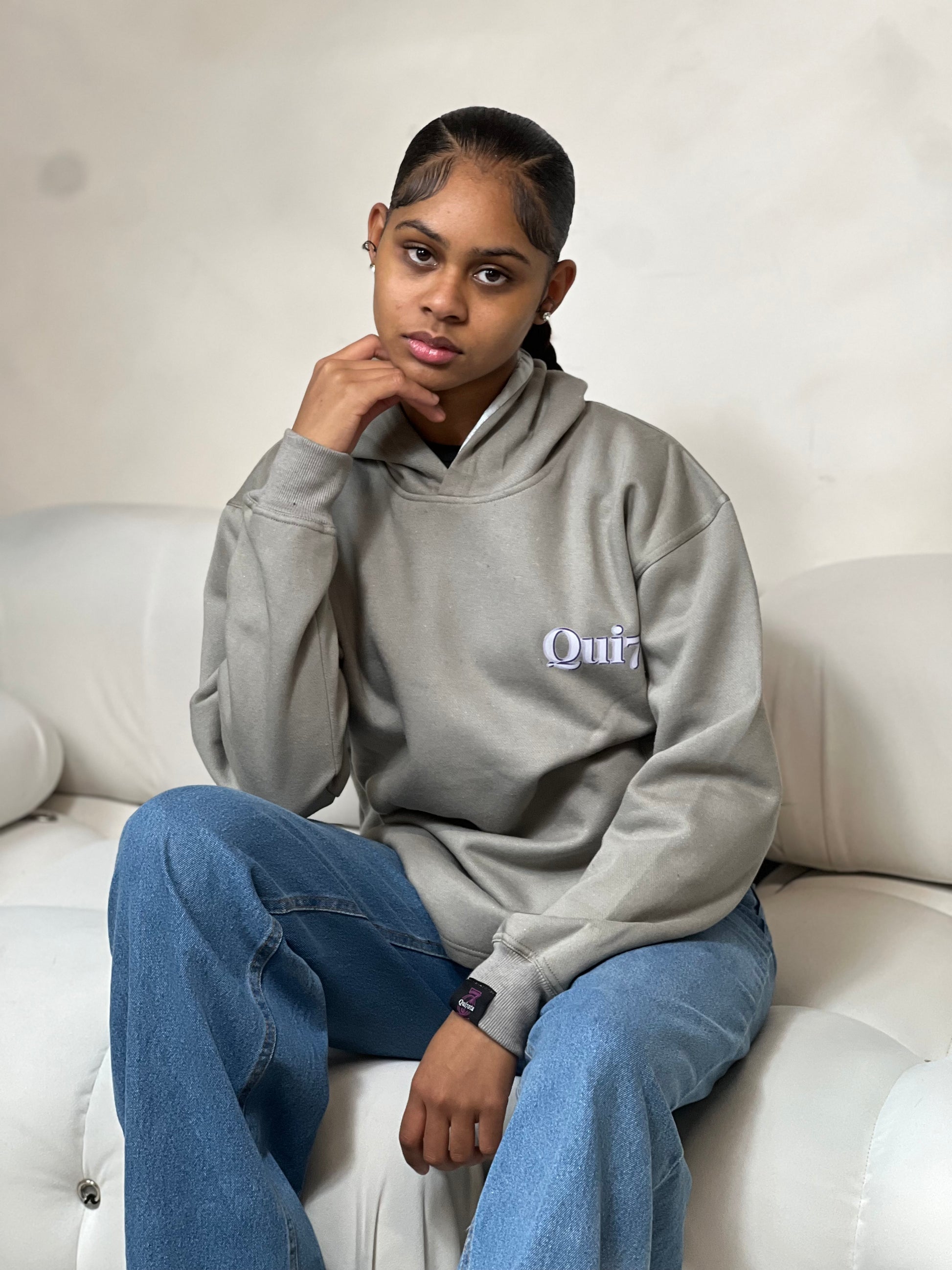 "Grey relaxed-fit pullover hoodie featuring a bold graphic design across the chest. Made from soft fleece material, it has an adjustable drawstring hood, ribbed cuffs, and a kangaroo pocket for added comfort and functionality. The oversized fit offers a casual, laid-back style, perfect for everyday wear."



