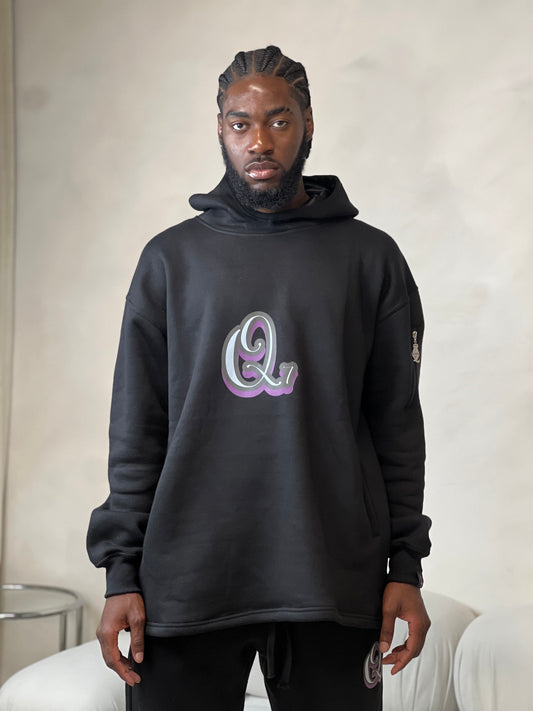 "Black relaxed-fit hoodie made from soft fleece fabric with a signature logo embroidered on the chest. Features a drawstring hood, ribbed cuffs, and a front kangaroo pocket for a casual, comfortable fit."



