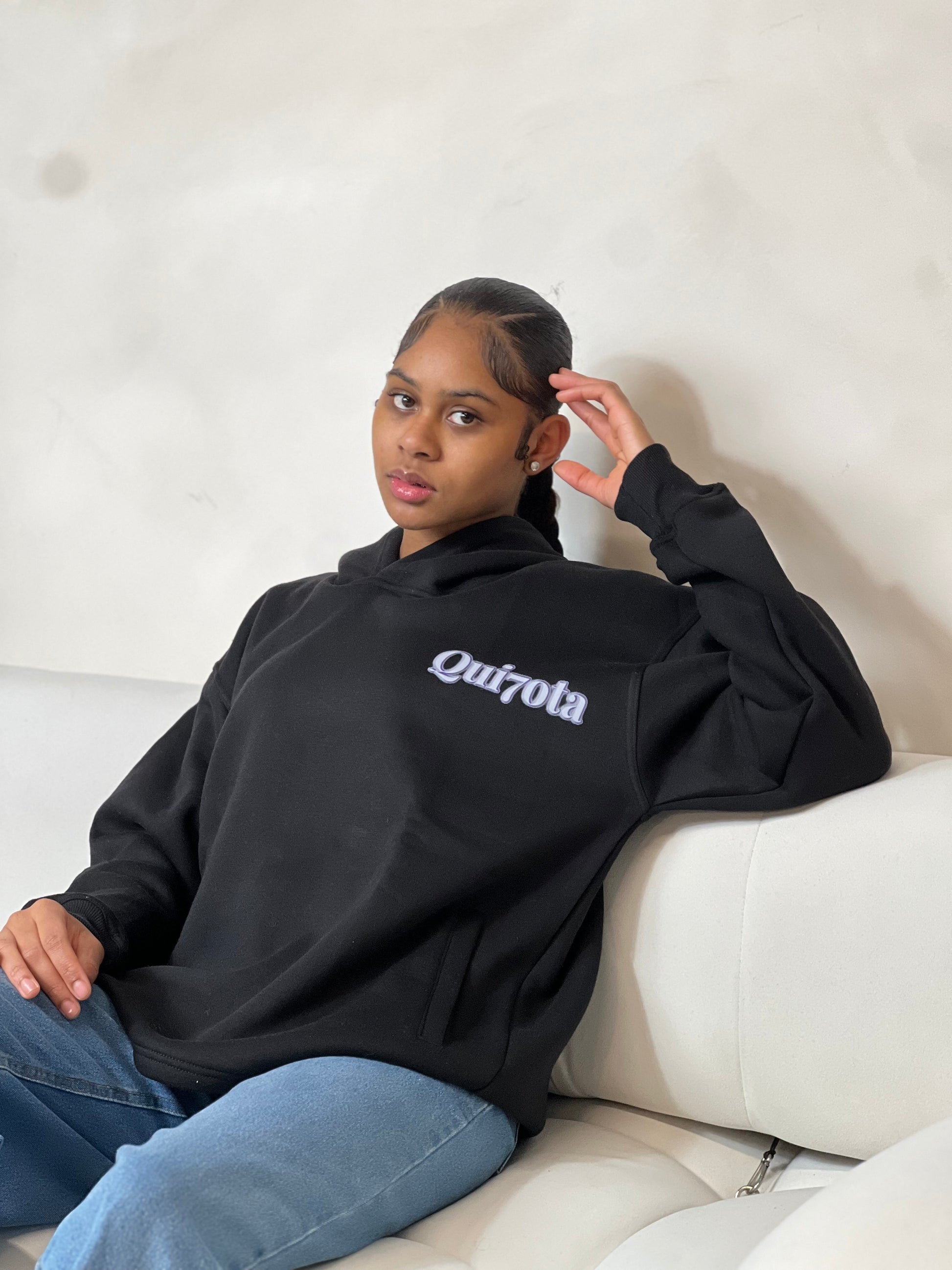 
"Black graphic relaxed pullover hoodie featuring a bold, modern design on the front. The hoodie has a comfortable, oversized fit with a spacious hood, ribbed cuffs, and a soft interior, perfect for casual wear."