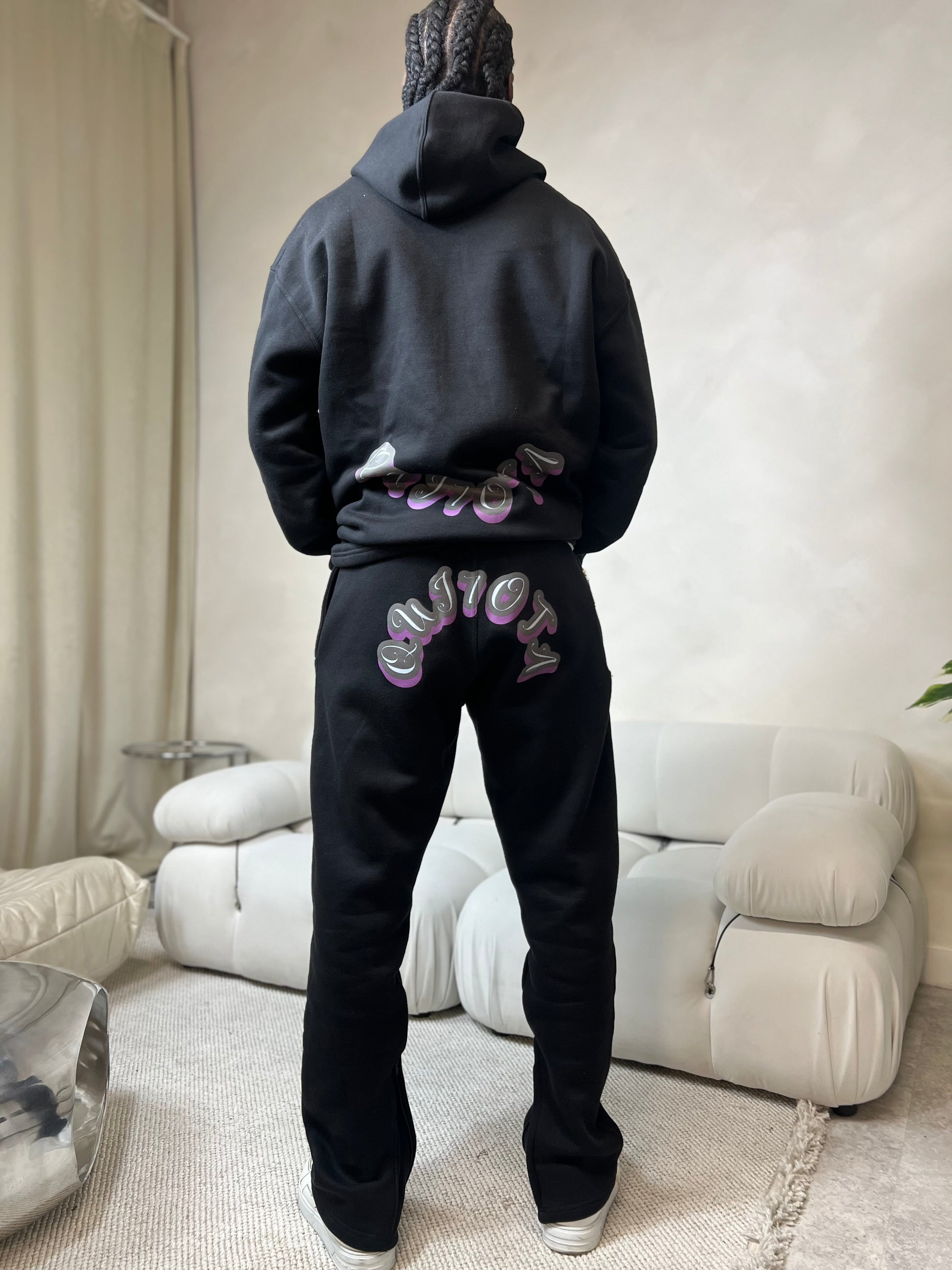 "Black relaxed fit lounge pants made from a premium cotton-blend fabric. Featuring a comfortable elastic waistband with an adjustable drawstring, subtle Signature logo embroidery on the hip, and tapered legs for a modern, flattering silhouette. Ideal for casual wear or lounging at home. Available for pre-order."






