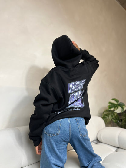 "Black graphic relaxed pullover hoodie featuring a bold, modern design on the front. The hoodie has a comfortable, oversized fit with a spacious hood, ribbed cuffs, and a soft interior, perfect for casual wear."